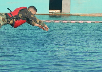 Competitors dive into action during Fuerzas Comando aquatic event