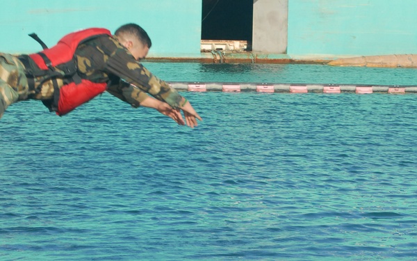 Competitors dive into action during Fuerzas Comando aquatic event