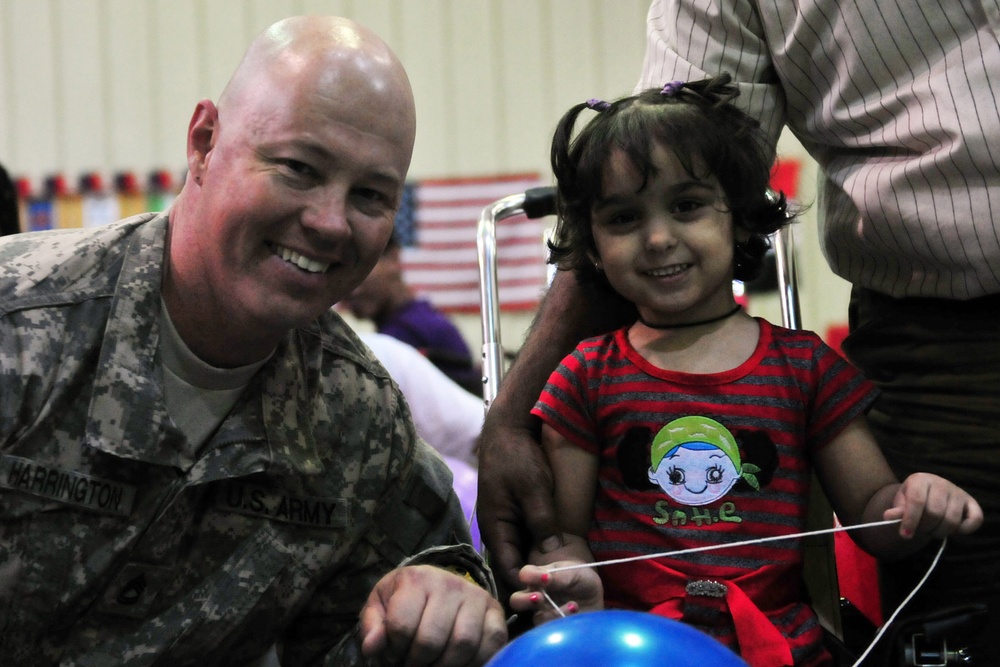 Volunteers from 1st AD provide wheelchairs to disabled Iraqi children