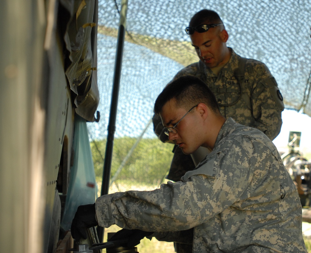Field Artillery Soldiers Prep Rounds