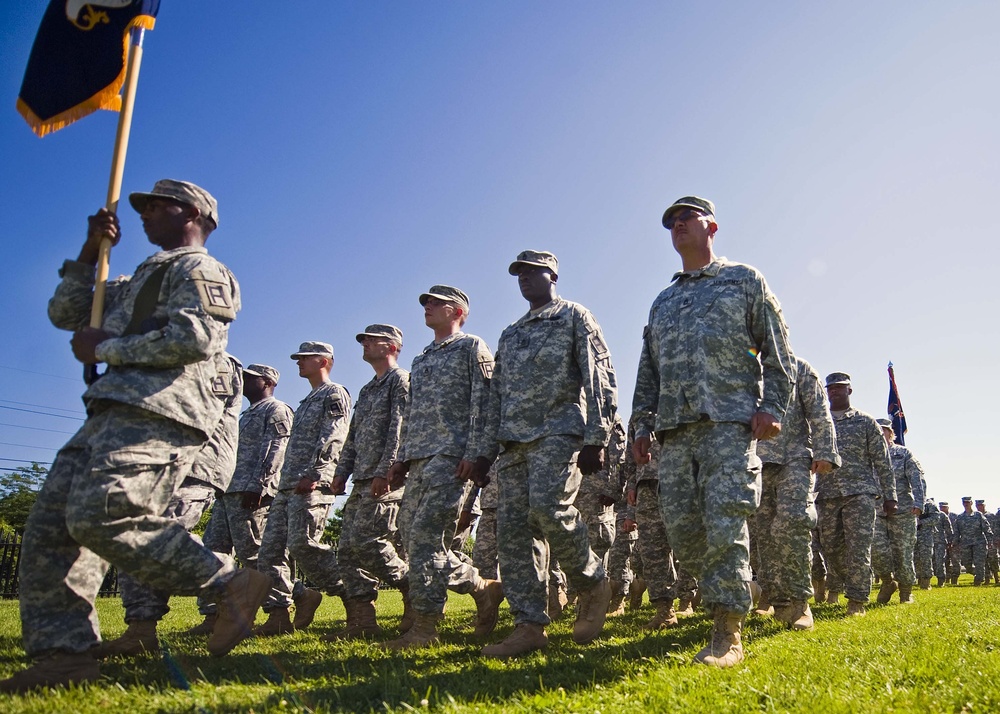 Soldiers of the 205th Infantry Brigade, First Army Division East march off the field after the brigade's change-of-command ceremony held at the Veteran's Memorial, Camp Atterbury Joint Maneuver Training Center in central Indiana June 30.
