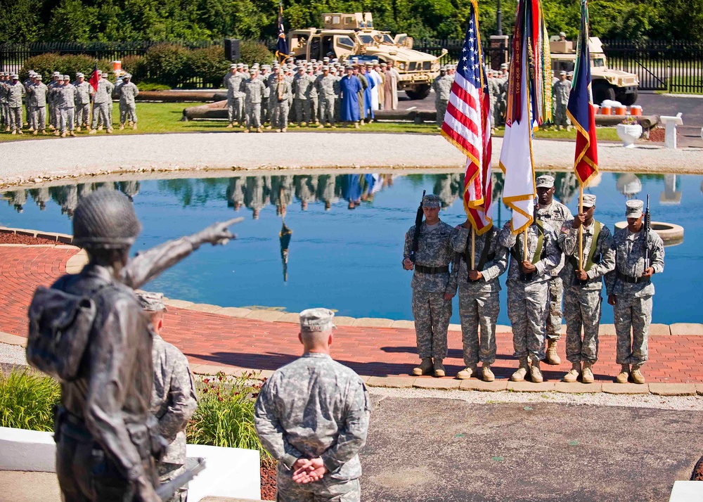 Soldiers of the 205th Infantry Brigade, First Army Division East welcome their new commander during the brigade's change-of-command ceremony held at the Veteran's Memorial, Camp Atterbury Joint Maneuver Training Center in central Indiana June 30.