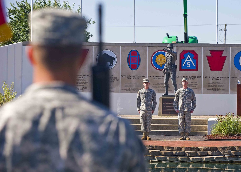 Soldiers of the 205th Infantry Brigade, First Army Division East recite the Soldiers Creed at the brigade's change-of-command ceremony held at the Veteran's Memorial, Camp Atterbury Joint Maneuver Training Center in central Indiana June 30.
