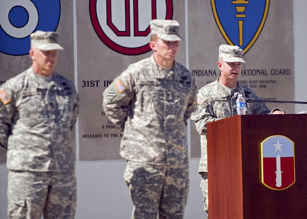 Col. Timothy E. Newsome, the new brigade commander for the 205th Infantry Brigade, First Army Division East, greets his new unit during the brigade's change-of-command ceremony held at the Veteran's Memorial, Camp Atterbury Joint Maneuver Training Center