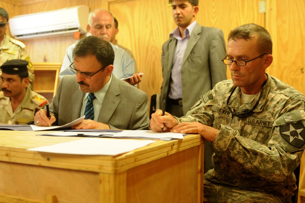 Strykers sign over their final base to Iraqi army