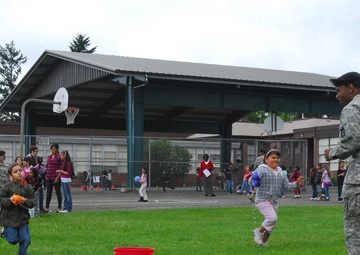 Soldiers Give 'aid' to Local Students, School
