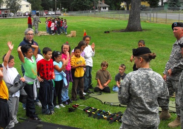 Soldiers Give 'aid' to Local Students, School