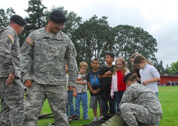 Soldiers give ‘aid’ to local students, school