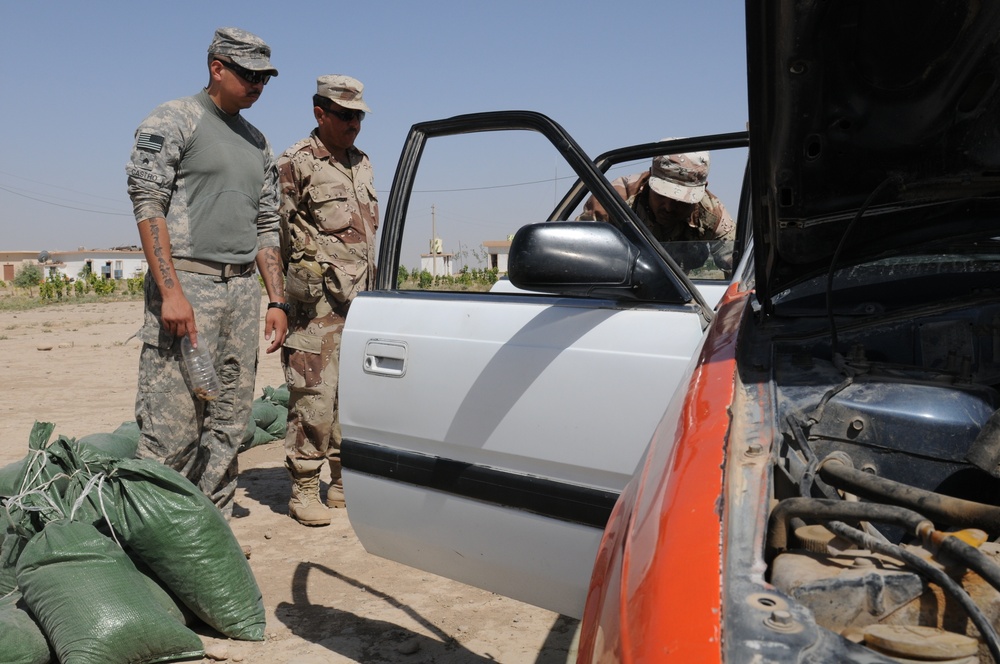 2-3 FA trains Kurdish Regional Guard on how to conduct traffic control point searches.