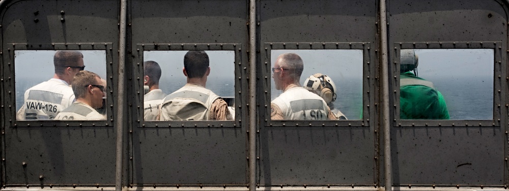 Sailors wait for aircraft to land