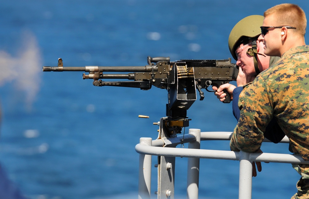 Sailor Fires Machine Gun