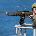 Sailor Fires Machine Gun