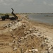 Guardsmen reinforce rock wall along Caminada Pass