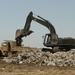 Guardsmen reinforce rock wall along Caminada Pass