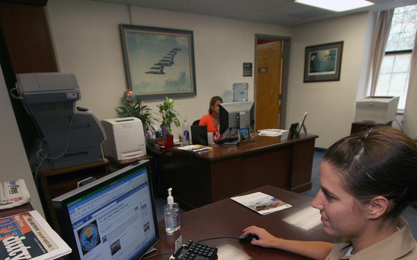 Sailor looks at Facebook