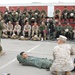 Corpsmen teach Marines of ten nations how to save lives with battlefield trash
