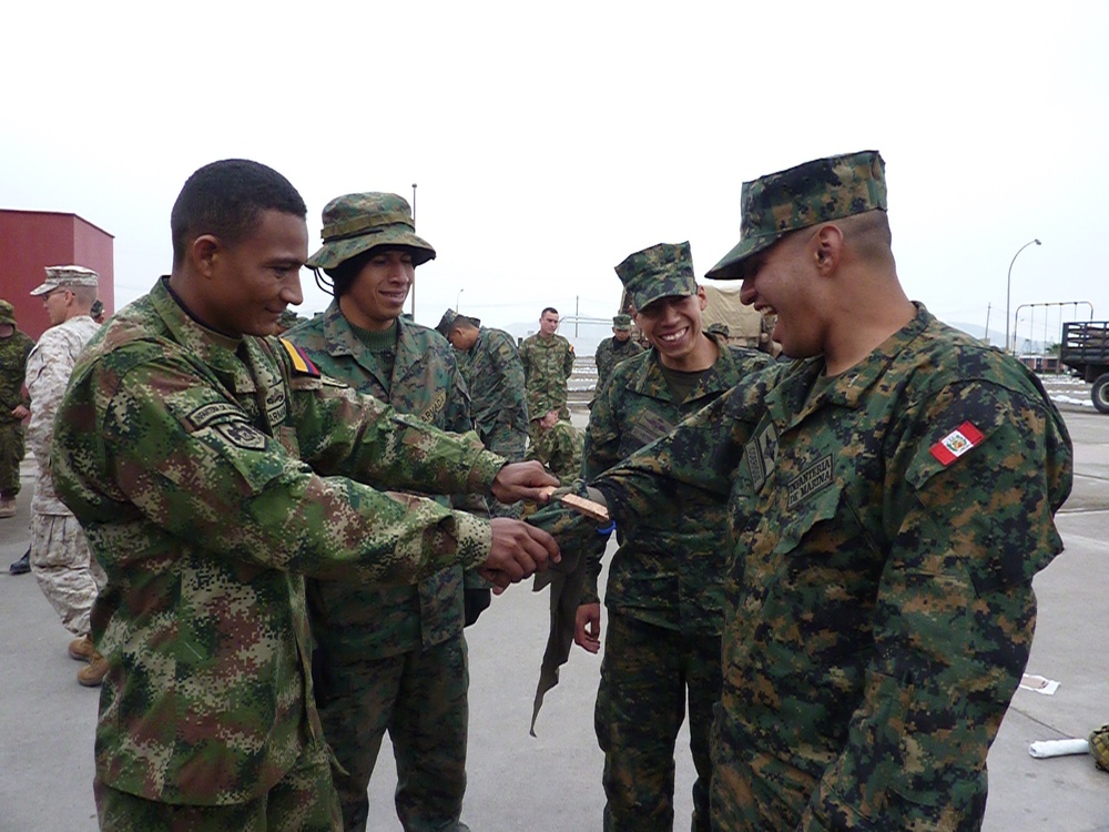 Corpsmen teach Marines of ten nations how to save lives with battlefield trash