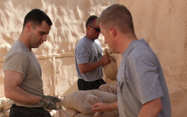 Soldiers fill sandbags for exercise