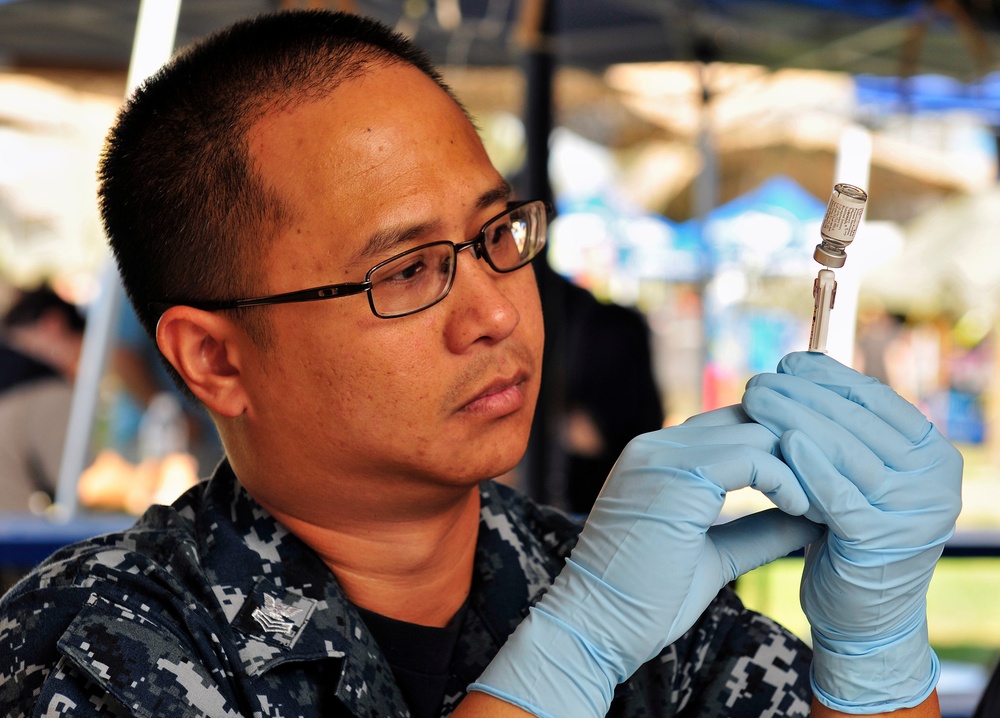 Petty Officer 1st Class Thomas Cabuco, hospital corpsman, assigned to Naval Medical Center San Diego, draws Tuberculin Purified Protein Derivative into a syringe to be used in free Tuberculosis testing for homeless veterans during the Veteran's Village of