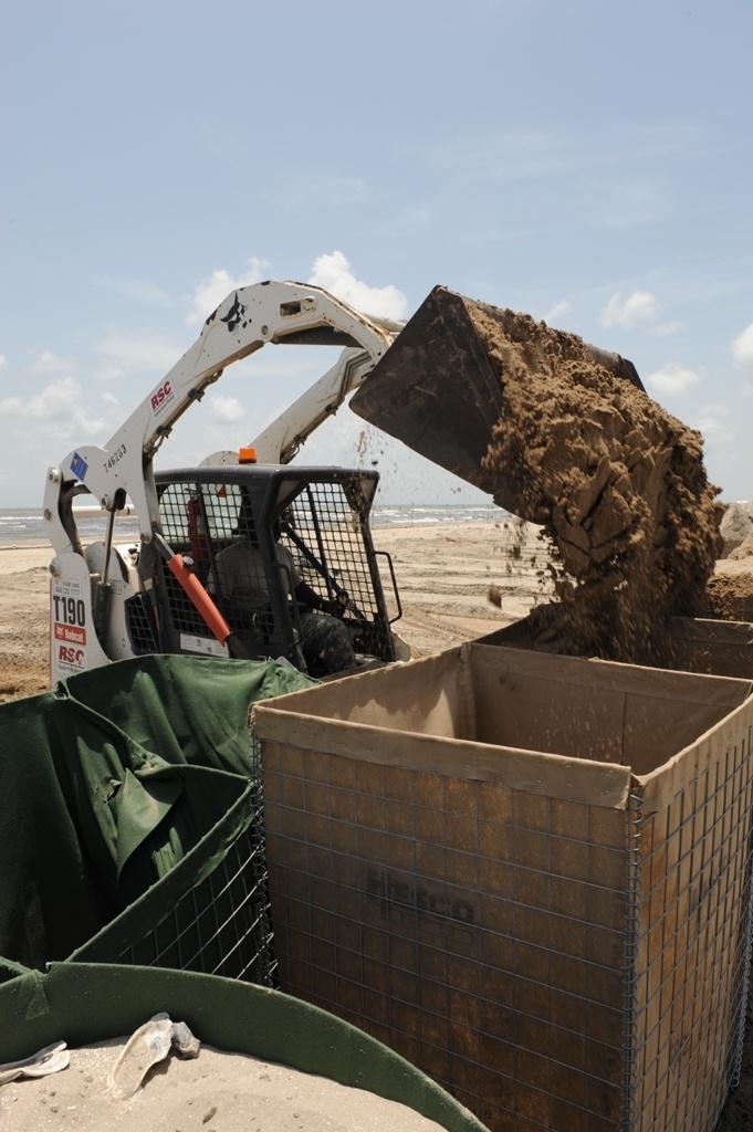 Guardsmen reinforce coastal protection barriers