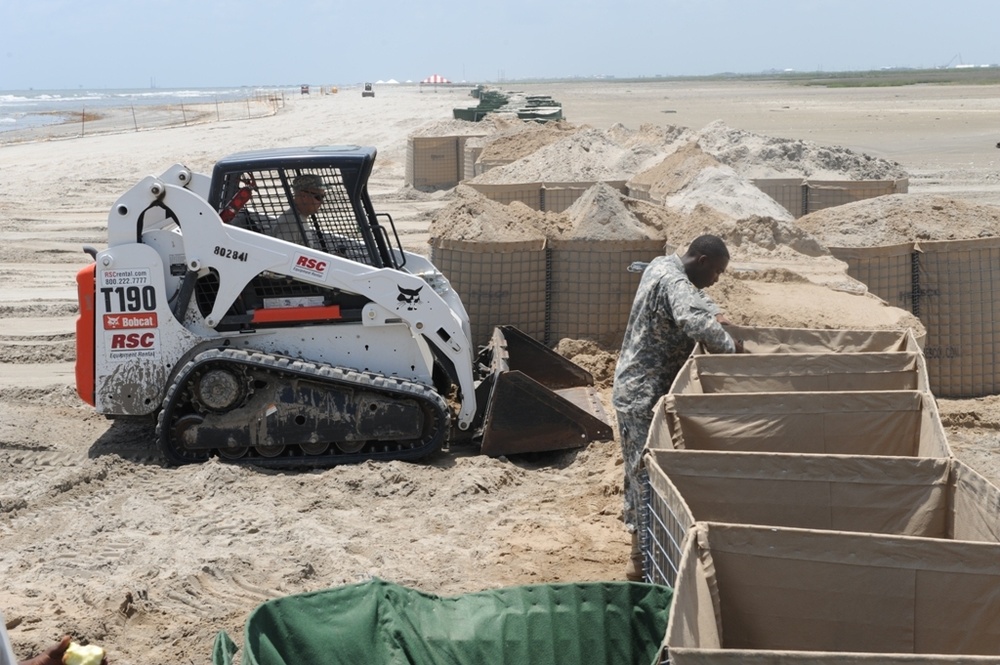 Guardsmen reinforce coastal protection barriers