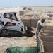 Guardsmen reinforce coastal protection barriers