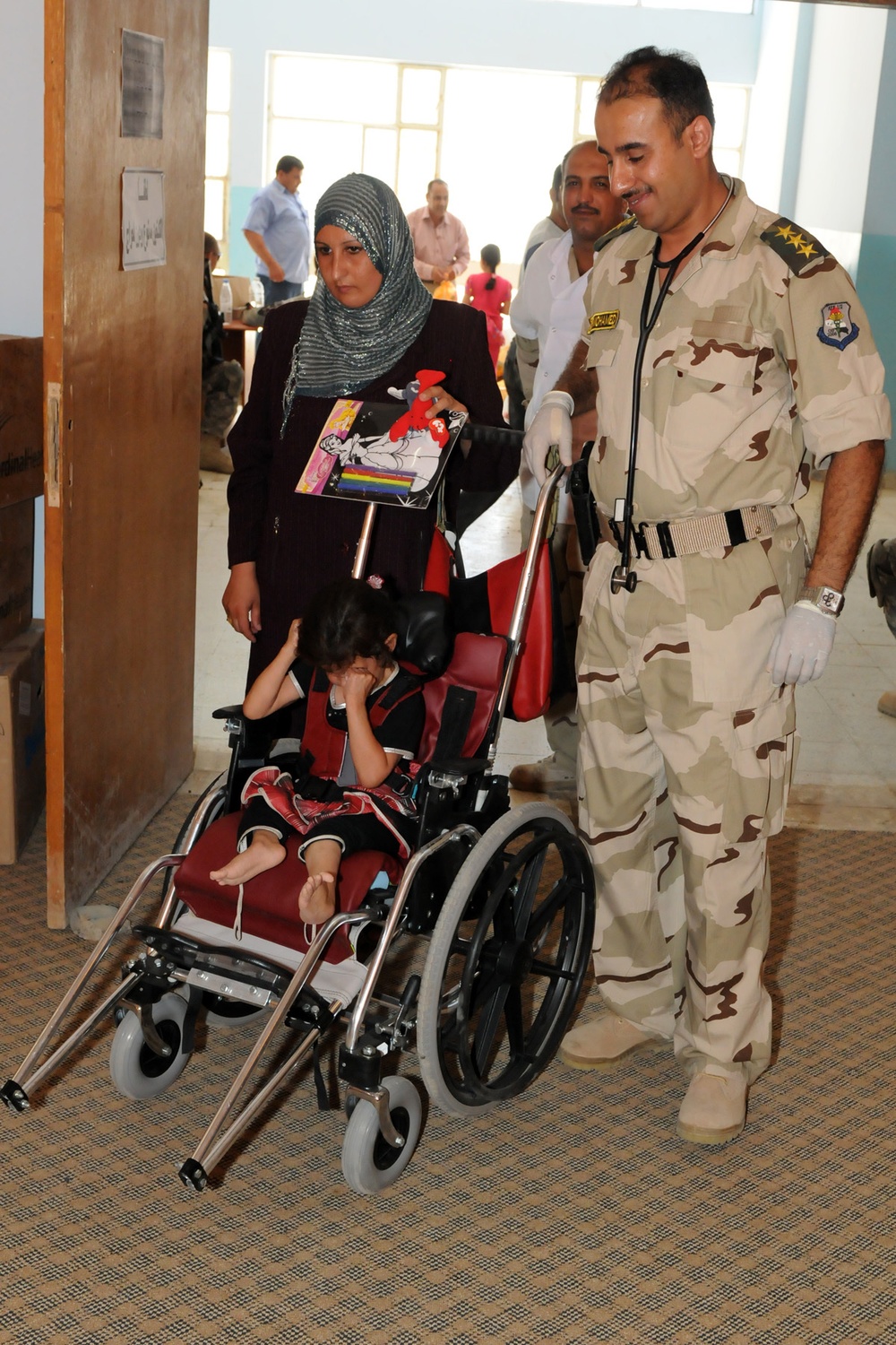 Iraqi, US Soldiers provide mobility for disabled child