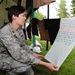 Capt. Penny Ripperger, the 119th Wing sexual assault response coordinator, reads a poem written on a t-shirt July 28, at a Clothesline Project visual display on the Veteran's Administration Hospital grounds, Fargo, N.D. The Clothesline Project display USE