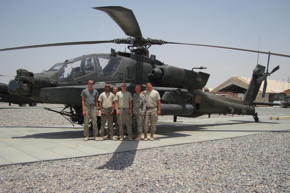 Soldiers Pose Next to Helicopter