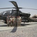 Soldiers Pose Next to Helicopter