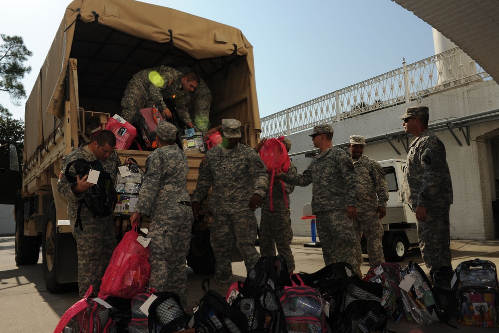 Guardsmen help first lady of Louisiana deliver school supplies