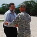 Col. Michael Borrel, Task Force Kout Men Commander, Greets Ambassador Paul A. Trivelli, Deputy to the Commander and Foreign Policy Advisor, U.S. Southern Command, During His Visit to Gonaives, Haiti Aug 4