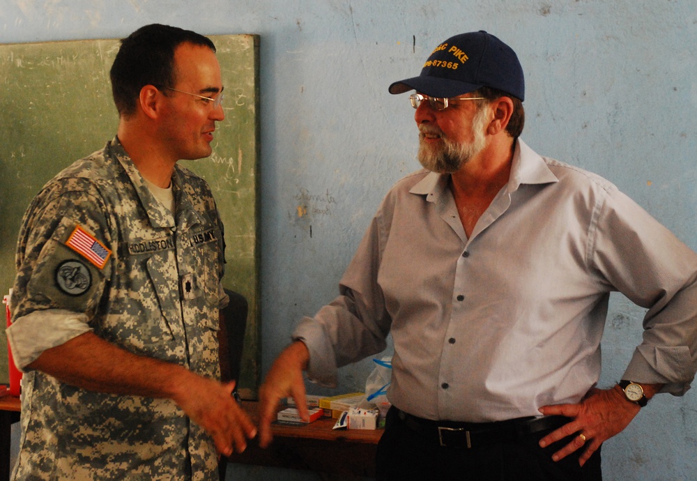 Ambassador Paul A. Trivelli, Deputy to the Commander and Foreign Policy Advisor, U.S. Southern Command, Visits With Task Force Kout Men New Horizons-Haiti 2010 Seabees During a Visit to the Diaqoui School Engineering Sites in Gonaives, Haiti Aug 4.