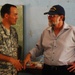 Ambassador Paul A. Trivelli, Deputy to the Commander and Foreign Policy Advisor, U.S. Southern Command, Visits With Task Force Kout Men New Horizons-Haiti 2010 Seabees During a Visit to the Diaqoui School Engineering Sites in Gonaives, Haiti Aug 4.