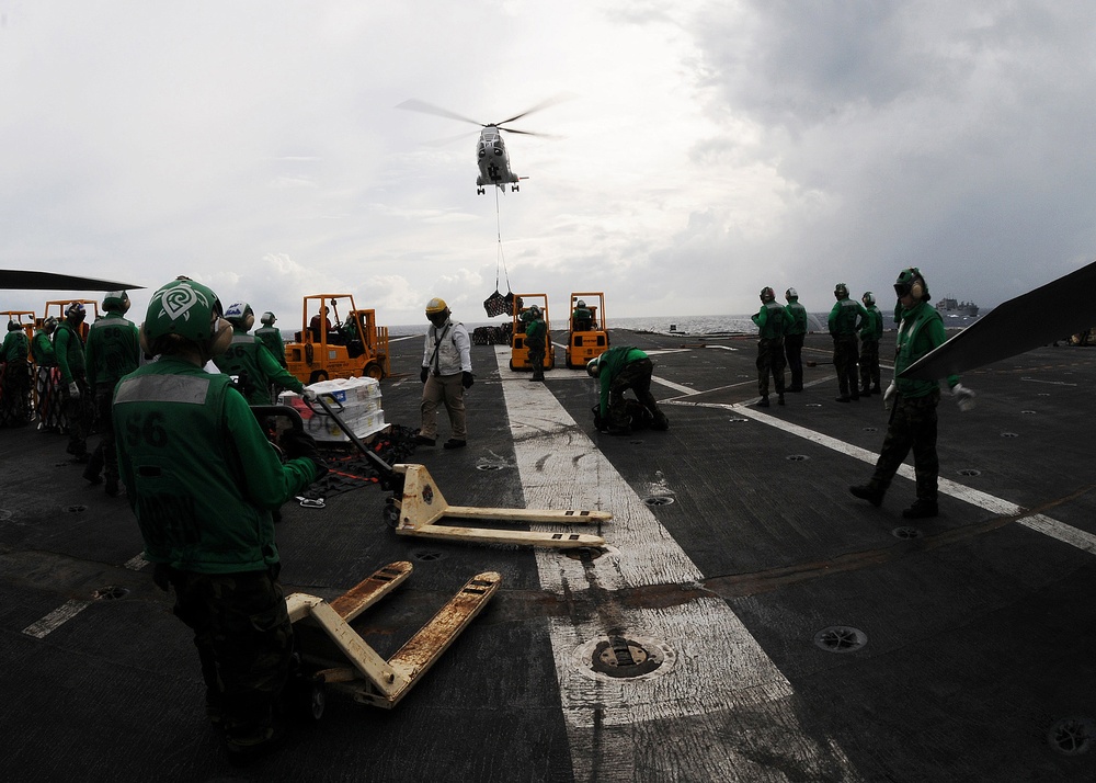 USS George Washington takes on supplies