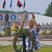 Gustav Pothoff of Columbus, Ind., pays respect to the fallen at the Prisoner-of-War and Missing-in-Action Memorial at Camp Atterbury Joint Maneuver Training Center Reflecting Pond in central Indiana, Aug. 14 during the 18th Annual Veteran's Memorial held