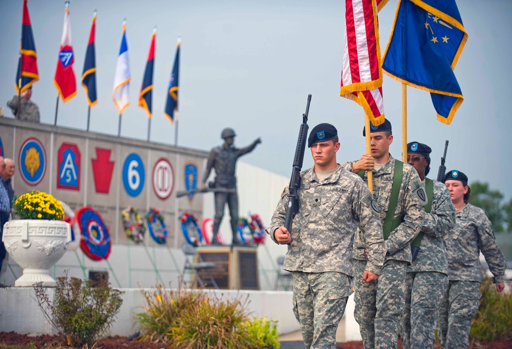 The Color Guard marches off the parade field after the 18th Annual Veteran's Memorial held at Camp Atterbury Joint Maneuver Training Center in central Ind., Aug. 14. The ceremony honors several units that have served and deployed from Camp Atterbury in su