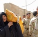 In preparation for the fast: IA soldiers feed 200 needy families in Tarmiyah