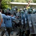 Multinational riot control training, U.S. soldiers play rioters