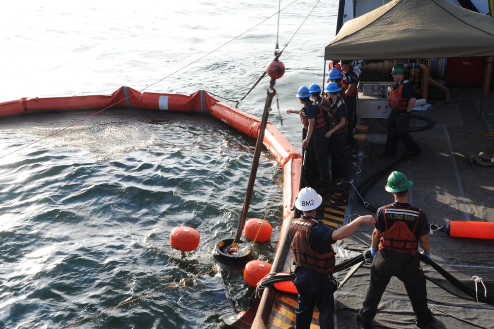 Crew of Cutter Juniper Deploys Spilled-Oil Recovery System