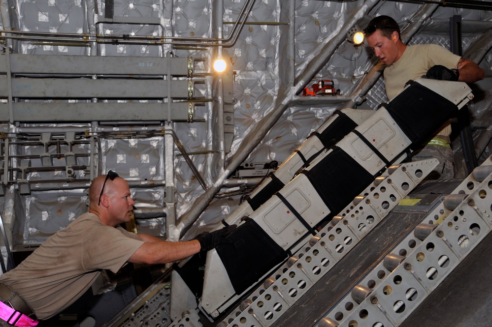 Airmen Turn Cargo Plane Into Passenger Plane