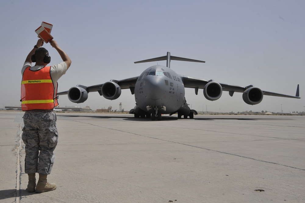 Airmen Turn Cargo Plane Into Passenger Plane