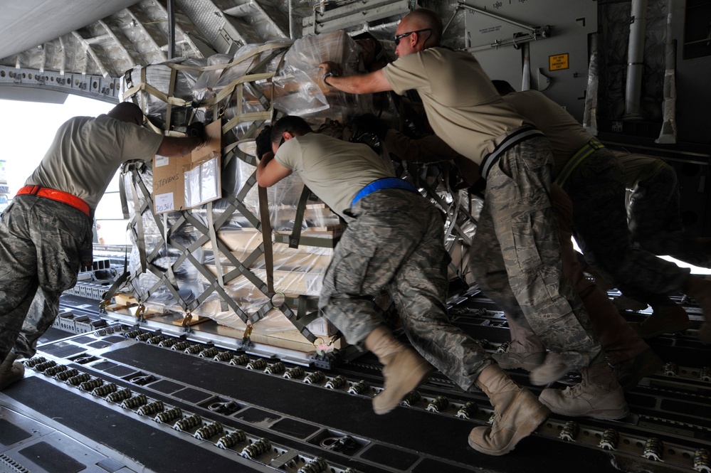 Airmen Turn Cargo Plane Into Passenger Plane