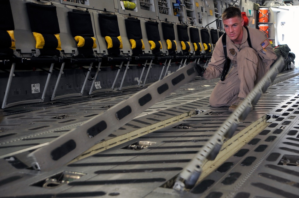 Airmen Turn Cargo Plane Into Passenger Plane