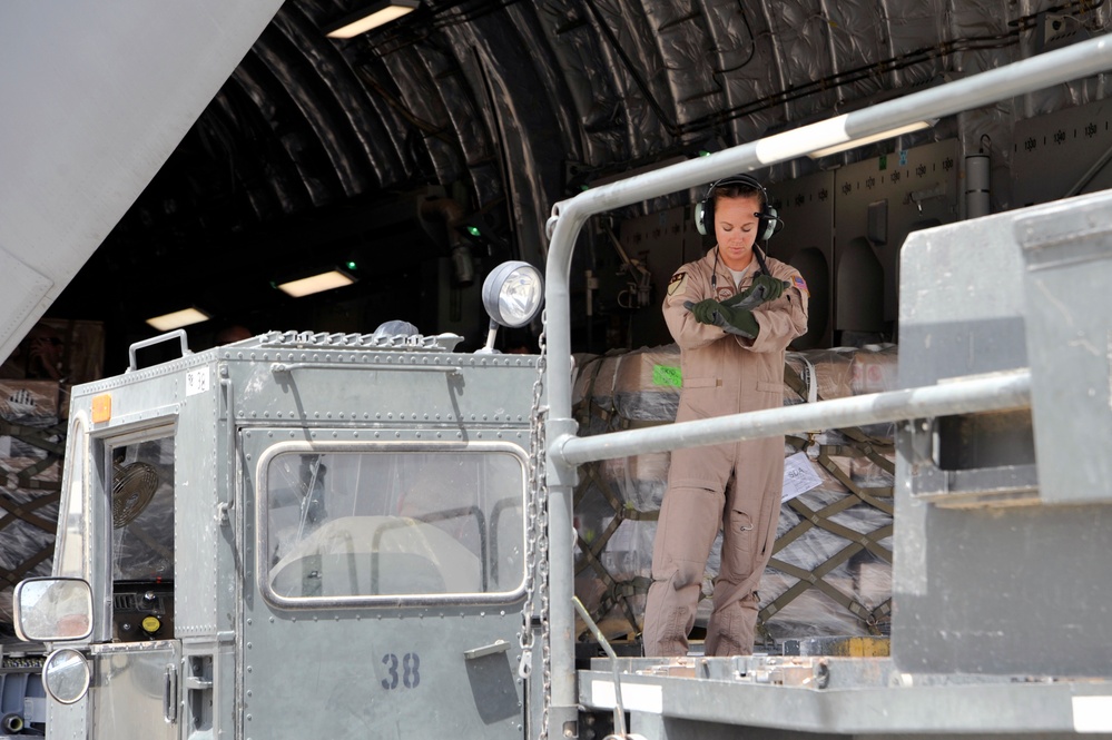 Airmen Turn Cargo Plane Into Passenger Plane