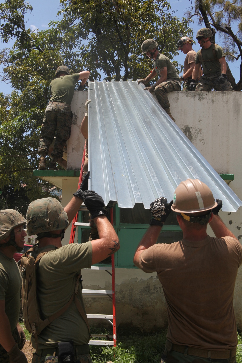 Marines, sailors sweat off a good deed during construction work in Haiti