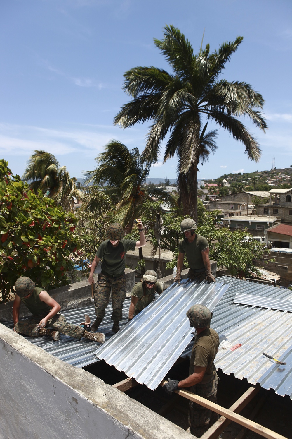 Marines, sailors sweat off a good deed during construction work in Haiti