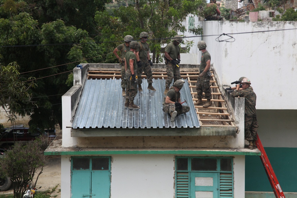 Marines, sailors sweat off a good deed during construction work in Haiti