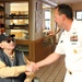 Command Master Chief Petty Officer Dave Bission, assigned to Navy Region Northwest, visits with Jake Lambert, a World War II Navy Veteran and prisoner of war, at the Veteran's Home during Boise Navy Week. Lambert was taken prisoner of war for 75 days afte