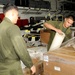 Sailors prepare relief supplies for Pakistan